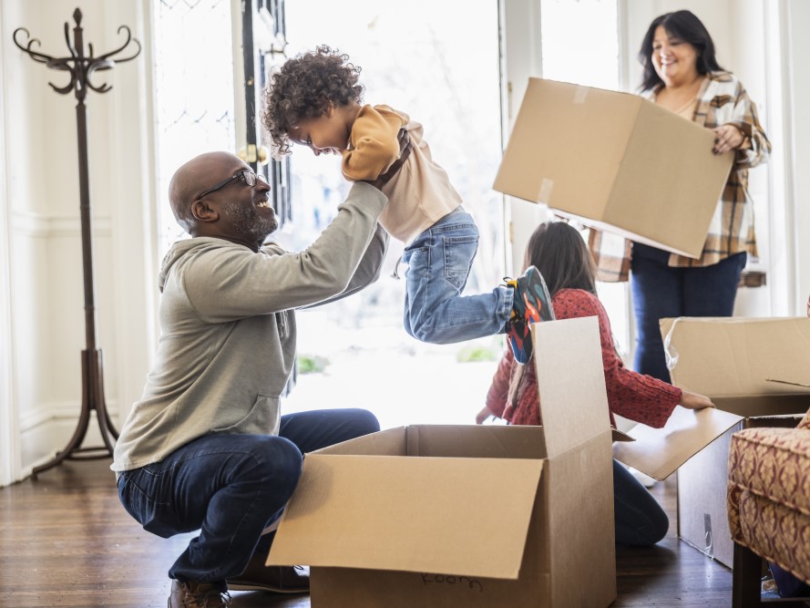 A family unpacking boxes